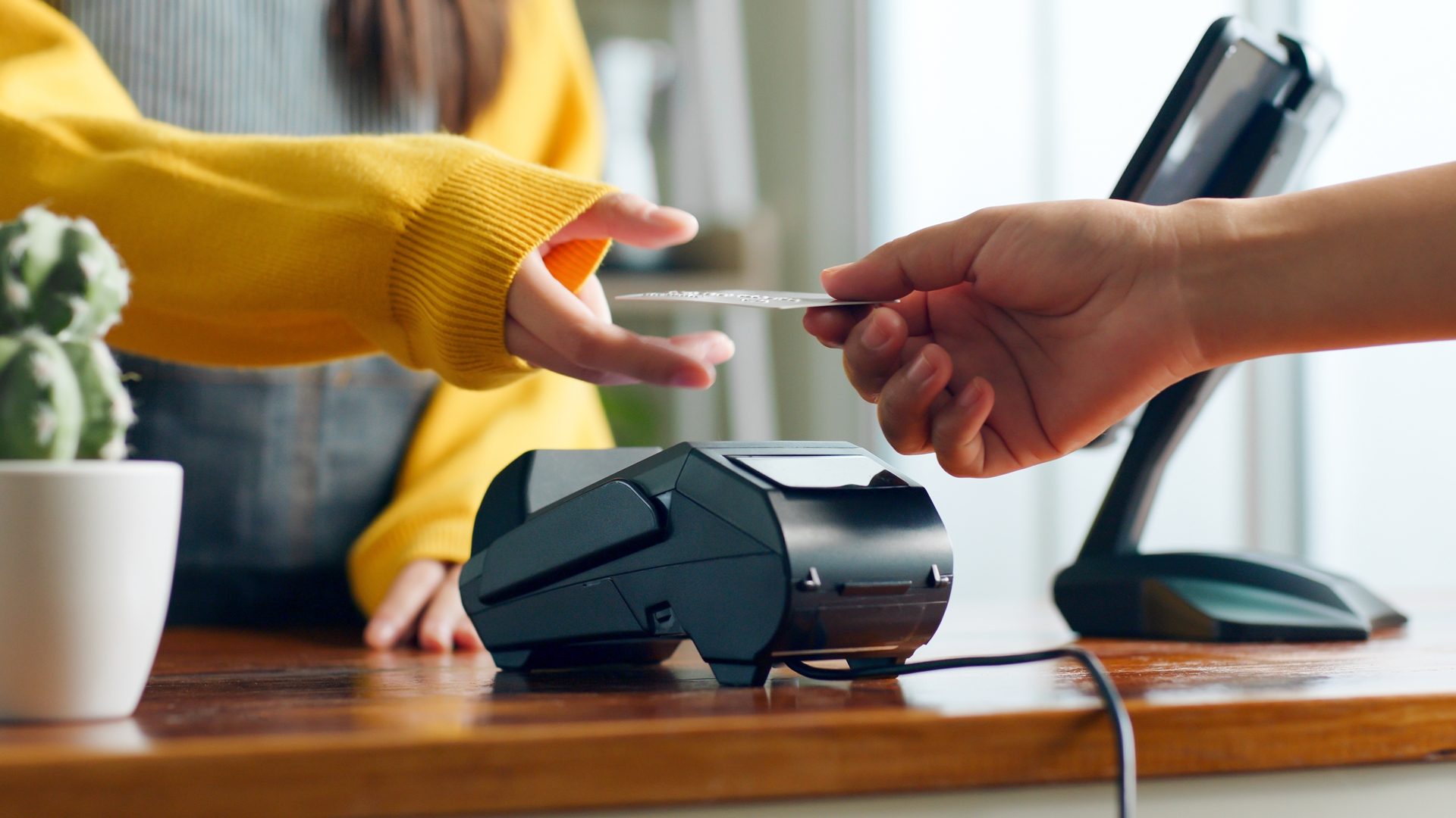 Customer using credit card for payment to owner