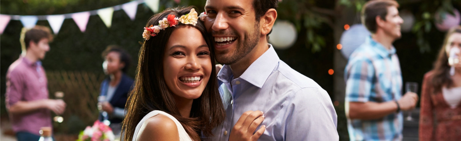 A couple smiling at a camera