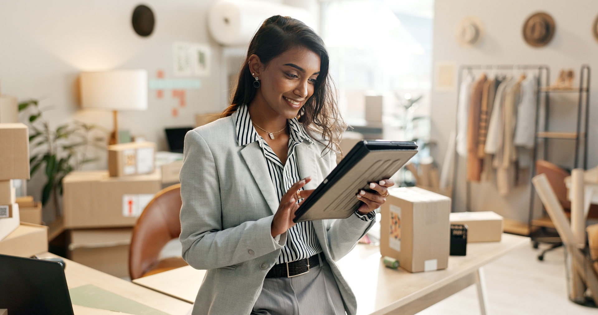 woman and online stock check with shipping company