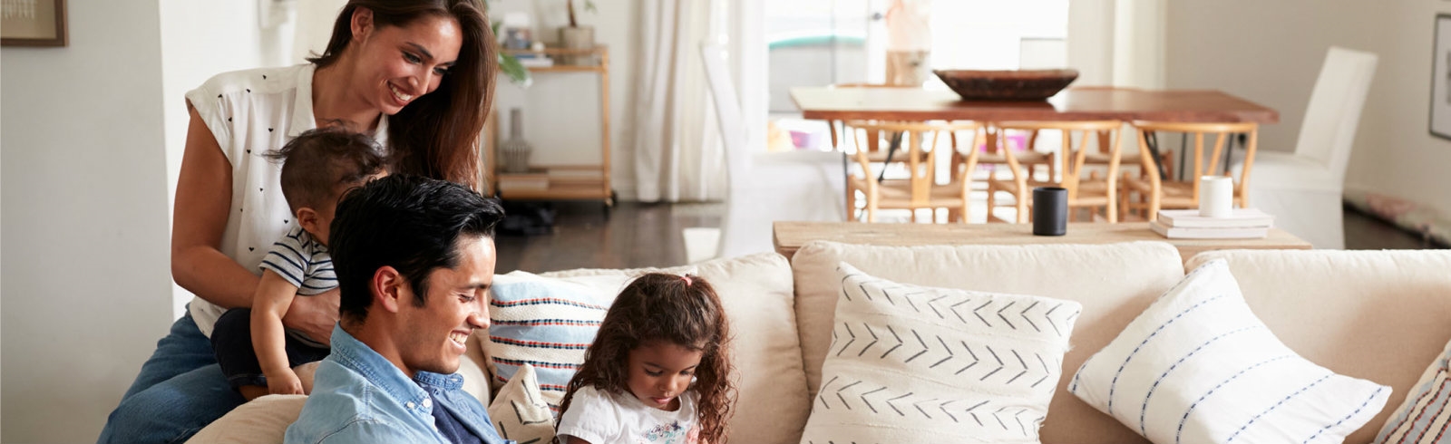 A family playing on a couch