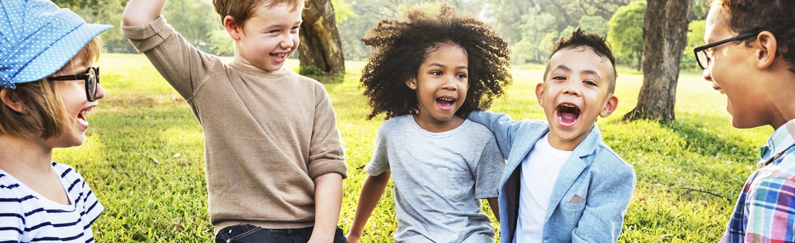 Children laughing and playing in a park