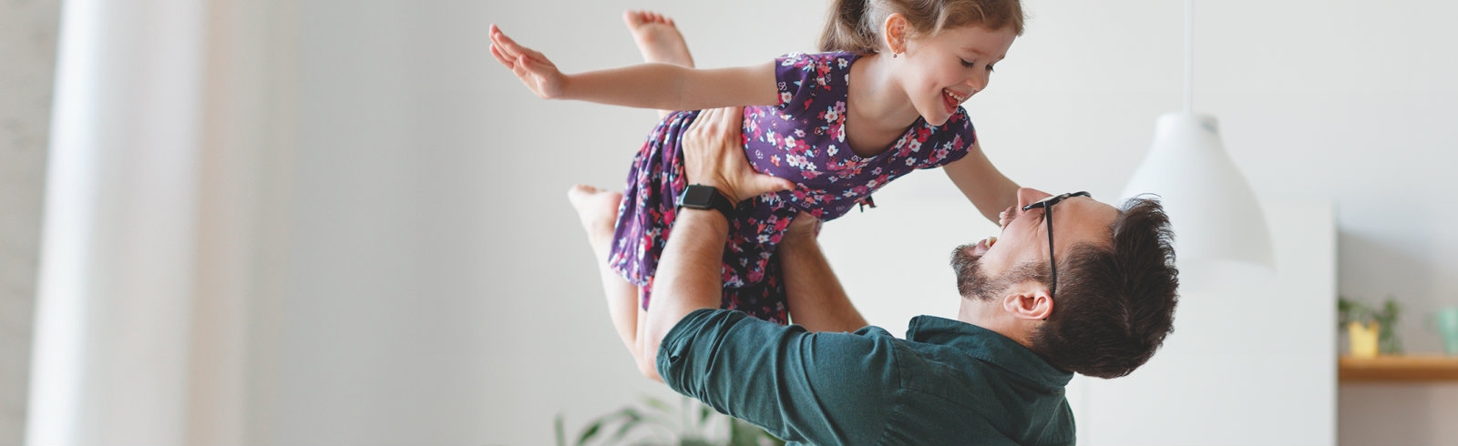 Man playing with his daughter