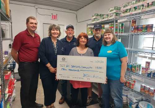 SSB Wanamingo employees posing with a check