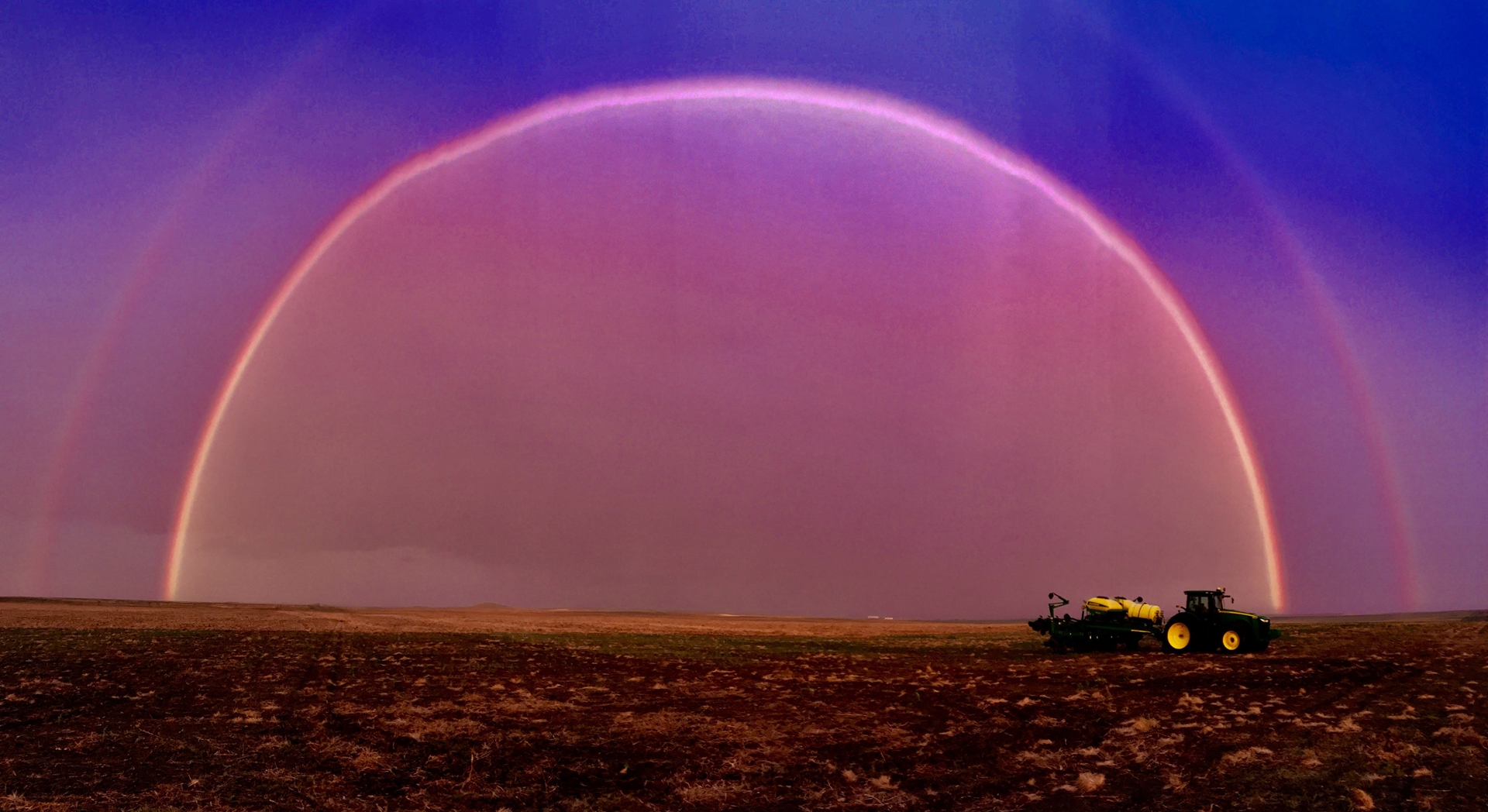 Rainbow over a ploughed field